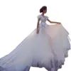 Abiti da sposa sexy A Line Abito da sposa trasparente manica corta Backless Fiori 3D Appliques Tulle Lunghezza pavimento Robe De Soiree