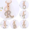 Chaveiros requintados A-Z 26 Letter Rhinestone liga-ligas Charms de ouro iniciais de ouro Key Ring Women Women Holder Bag Ornaments Accessoreis