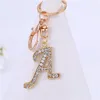 Chaveiros requintados A-Z 26 Letter Rhinestone liga-ligas Charms de ouro iniciais de ouro Key Ring Women Women Holder Bag Ornaments Accessoreis