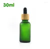 Garrafas de armazenamento por atacado 100pcs 30 ml garrafa de gotas de vidro verde de vidro verde com fosco com embalagem de tampa de bambu SN230