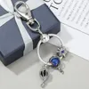 Keychains Silver Color Moon Star Astronaut Pendant Charm Keychain For Women Men Car Bag Keyring Accessions Wedding Party Gift