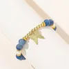 Strand Gold Tone Butterfly Charme Natural Stone Blue Breads Spacer Bracelet para mulheres