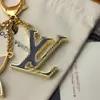 Fleur de Monogram sleutelhanger tasje Hanger m67119 Gouden ketting07446824