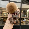 クリエイティブかわいいキーホルダー革猫ペンダント車のキーホルダーファッション女性のバッグペンダント