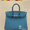 Kellyity Bag Designers sacs à main Birkinbag Femmes Sacs Tous le fil de cire manuel Couture BK25cm Swift Saddle Cuir Northern Blue Silver Button portable Femme grande AYW