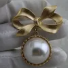 Śliczna broszka broszka Bowknot Vintage Pearl broszki garnitujące klapy do piszczalni biżuteria mody