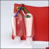 Bottiglie da imballaggio Bottiglia vuota riutilizzabile per alcol da 50 ml con gancio portachiavi Disinfettante per le mani in plastica trasparente trasparente per bottiglie da viaggio Dhaft