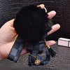 Sevimli ponpom anahtarlık moda kedi oyuncak ayı tasarımcısı anahtar zincir yüzüğü hediyeler kadın pu deri araba tokaları çanta cazibe aksesuarları erkek hayvan anahtarlık tutucu