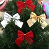 クリスマスの装飾12pcsかわいい弓のきらめき飾りクリスマスツリーデコレーションフェスティバルパーティーホームボウノットボーブル2022年