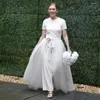 Jupes Styliste de mode Blanc Over Wrap Femmes A-ligne Longue Mariée Tulle Train Détachable Avec Ruban Ceinture Bow Femme Maxi Jupe
