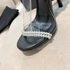 2022 Дизайнер заостренные пальцы на высоких каблуках жемчужные сандалии роскошные 100% кожаная мода Женщины One Shoelace Bantage Обувь, покрытые Sexy Sexy Stiletto в середине кальтиров, 35-39