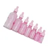 Imballaggio vuoto Vetro Bottiglia rosa trasparente Spalla rotonda Colletto rosa cosmetico Pipetta in gomma Fiale Contenitore di imballaggio riutilizzabile 5 ml 10 ml 15 ml 20 ml 30 ml 50 ml 100 ml