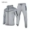 Dünner Designer-Trainingsanzug, One Zip Me, Sportbekleidung, Jacke, Hose, Damen-Trainingsanzug aus Tech-Fleece, Herren-Langarm-Jogger, lässiges blaues Techfleece