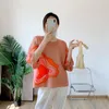 القمصان النسائية Miyake Fold 2022 فانوس فانوس فانوس جولة حول الرقبة الماسي طباعة القميص الأرجواني قصير الأكمام