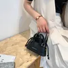 2022 koreanische Mode-Trend Retro Messenger Textur Schulter Frauen Tasche Sommer Nette Mini Shell Kordelzug Kleine Handtasche