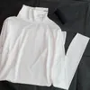 H￶sten 2023 mode kvinnors t -shirt l￥ng￤rmad bas svartvit 2 f￤rg designer lyxig bomull elastisk mjuk komfort triangel trim