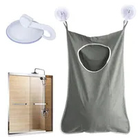 Förvaringslådor smutsiga kläder hängande väska bakom dörren och bärbar vägg