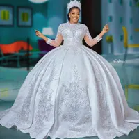 2023 Ball Gown Wedding Dresses Luxury Jewel Neck Full Lace Appliqued Crystal Beads Illusion Long Sleeves Tulle Dubai Arabic Bride Bridal Gowns Plus Size