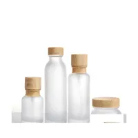 Verpackung von Flaschen Frosted Glas Jar Lotion Creme Runde Kosmetikgläser Handgepumpenflasche mit Holzkornkappe Kosmeti -Drop -Lieferung o dhxll