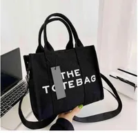 De draagtas hoogwaardige vrouwen luxe designer tassen canvas praktische grote capaciteit gewone handtassen munten purn square portefeuilles