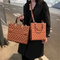 Design high quality series women's bag capacity tote hand autumn and large embroidered wire latticeHigh