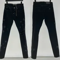 Star de jeans de grife masculino rasgado Jean Man Slim Jeans Casual Zipper Troushers Para calça de caju de calça de joia machos Hip Hop calça de jeans preto calças de carga preta