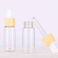 Empty Cosmetic Essense Bottles 5ml 10ml 15ml 20ml Glass Dropper Packaging Bottle With Plastic Wooden Grain Cap