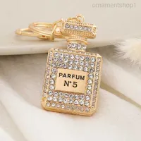 Crystal Perfume Bottle Keychains for Women Creative Diamond Bow Metal Key Chain Car Bag Pendant Small Jewelry Accessories 1lgow