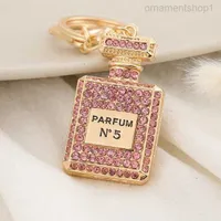 Crystal Perfume Bottle Keychains for Women Creative Diamond Bow Metal Key Chain Car Bag Pendant Small Jewelry Accessories 24mog