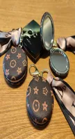 Fashion Design Leather Small Round Mirror Key Rings Keychains Women Portable Mini Folding Home Pocket Makeup Mirrors Key chains Ba1076943