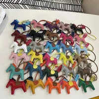 Handmade Real Leather Luxury Designers Keychains Women Rainbow Horse Headphone Bag Men Car Key Rings Pendant Accessories 30 Color315S