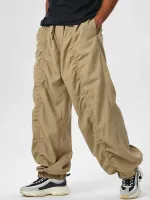 Spodnie towarowe dla mężczyzn Solidne marszczenie luźne narzędzia spusty sznurka śródustronna Spodnie spadochronowe z stopami belki
