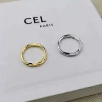 Nuevos anillos de banda de diseñadores pares delgados de pares minimalistas insigns de moda de cola irregular bague pareja anello con caja