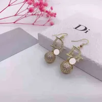 Charm earrings female alphabet new Brilliant Diamonds inlaid hollow out ball stereo spherical Earrings personalized ear hook exclusive Design jewel