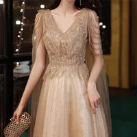 Party Dresses Champagne Gold Evening Dresses With Cape A Line Sexy Vneck Aline Shiny Luxury Beading Shawl Formal Celebrity Prom Gowns 220923