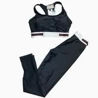 女性デザイナージムの服Gジョギングトラックスーツクロップトップパンツ2PCSスリムフィットスポーツヨガスーツセット女性ボディメカニック衣装スポーツ