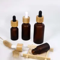 Botella de cuentagotas esencial de vidrio ámbar esbelto con tapa de gotero de bambú 1 oz botellas de aceite esencial 5 10 15 ml 30ml 50ml 1oz