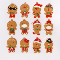 12pcs Gingerbread Man Ornnaments de árboles de Navidad colgantes colgantes Xmas lindo niño divertido regalo navidad en casa decoración de año nuevo