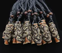 Lots Whole 12pcs COOL Boy men039s Simulation Bone Carving Totem Dragon Pendant Wood Beads Amulet Pendant Necklace Lucky Gif2909591