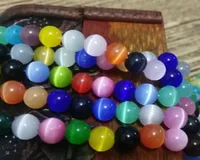 Cuentas redondas de 8 mm A Grado Cats Glass Flish Beads sueltos de 10 mm WhitecreamPinklt Powderdk Browndk Yellowlt Pink5860420