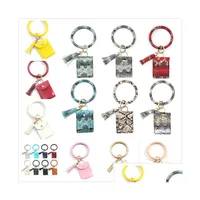 Ключевые кольца модные леопардовые и змеиные кожа кожа браслет -браслет для браслета Кредитный кошелек с кисточками подарки подарки подарки DH2EC