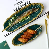 Tallrikar med grön banan bladform keramisk platta guld porslin laddare aptitretare dessert smycken maträtt servis sushi bordsartiklar