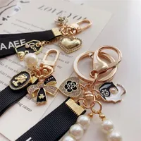 Designer Mode Keyring Schlüsselbilder Luxusmarken Perlen handgefertigte Keyrings Frauen Liebhaber Paar Taschen Autos Schlüsselketten Lanyards