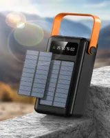 Nieuwe supercapaciteitsladers 150000 MAH Outdoor Travel Solar Mobile Power Supply wordt geleverd met gegevenskabel Eerste hulp Laad Bank op zonne-energie Camping Lamp