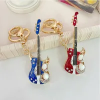 Jinglang New Fashion Rhinestone Microphone Guitar Keychain Emalj Nyckelringar för kvinnor Män handväska hängen smycken hantverk