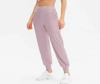 Lu Loose Sports Pants Women039s Correr atuendos de yoga de yoga Joggers Pocket Leisure Secado rápido Fitness Leggings Gym 9053427