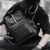 Mochila estilo masculino mochila mochila al aire libre viajes coreanos j￳venes gran capacidad bolso de cuero de moda liviano 221114