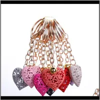 Aessories20Pcs Lot Whole Hollow Heart Fashion Charm Cute Purse Bag Pendant Car Keyring Chain Ornaments Gift Keychains T200804 655 Drop 259N