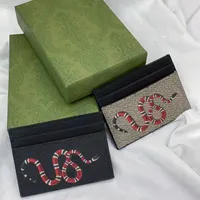 Carteiras de luxo Designers -chave Titular de couro genu￭no bolso de bolso slot de bolsa cl￡ssica Handbag Men Padr￣o de carimbo de moeda feminina portadores de cart￵es de carne de carneiro curto moda