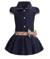 Baby Girls Sukienka Lapel College Bowknot z krótkim rękawem plisowana koszulka polo spódnica dla dzieci swobodne projektant ubrania dla dzieci 7233771